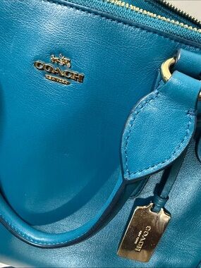 Coach Crosby Carryall Handbag in a vibrant teal/blue leather finish.